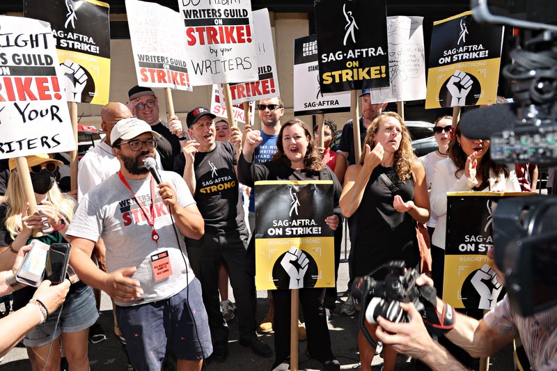 strikers with picket signs