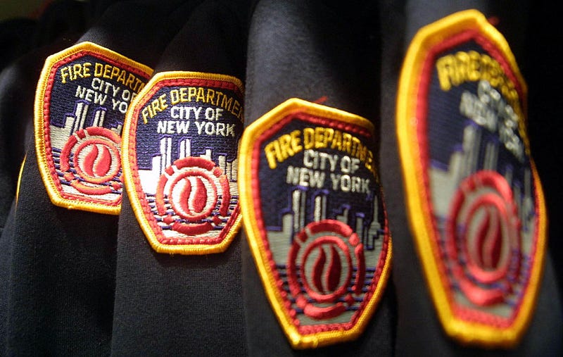 A FDNY firefighter was arrested for allegedly strangling his ex-wife in front of their 8-year-old child this weekend, police said.