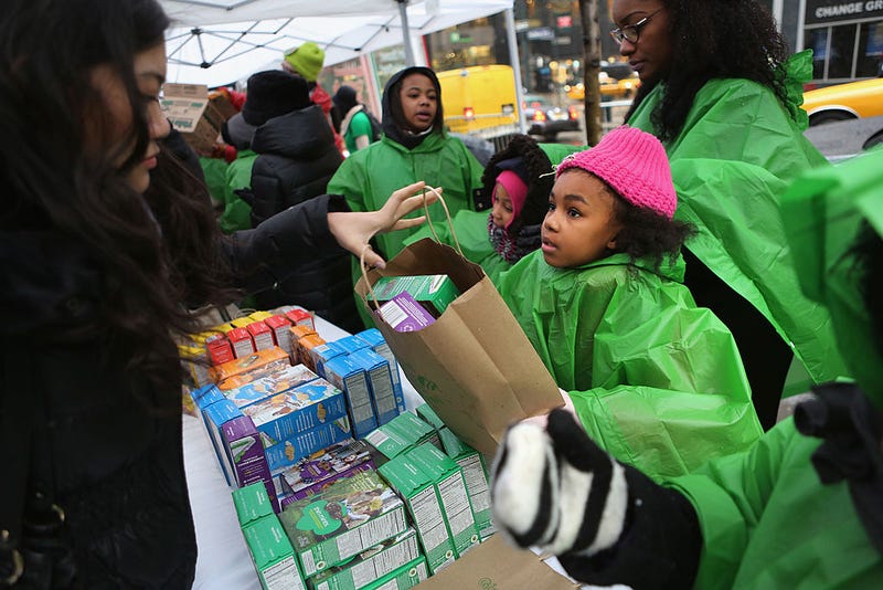Girl Scouts sell cookies as a winter storm moves in on February 8, 2013 in New York City. 