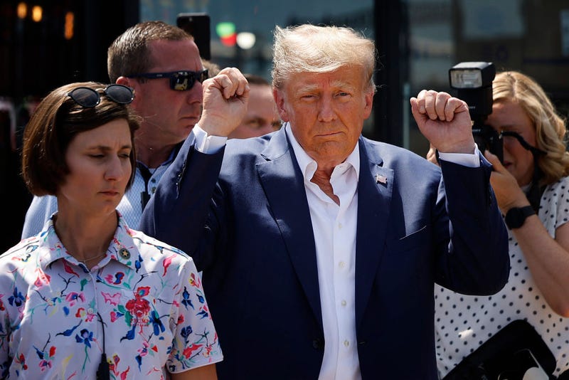 Former U.S. President Donald Trump acknowledges supporters as the visits the Iowa State Fair on August 12, 2023 in Des Moines, Iowa.