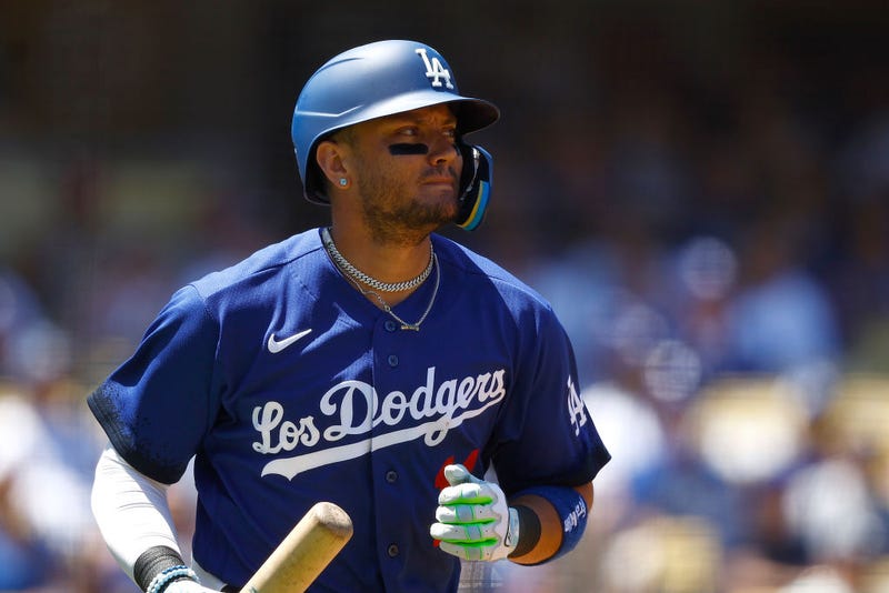 Miguel Rojas #11 of the Los Angeles Dodgers scores a run on a fly out against the Colorado Rockies in the second inning at Dodger Stadium on August 13, 2023 in Los Angeles, California.