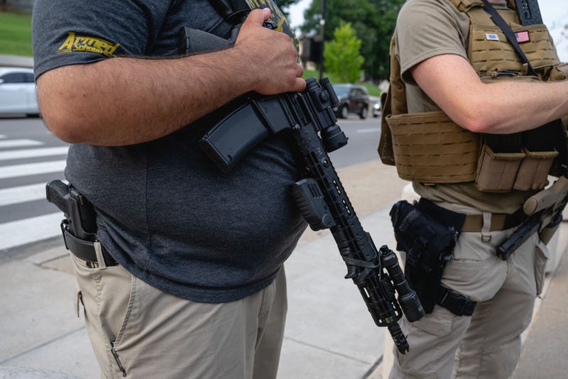 A pro-gun demonstrator sporting an AR-15 and a handgun is seen on the sidewalk outside after a special session is adjourned at the Tennessee State Capitol on August 21, 2023 in Nashville, Tennessee. Republican Tennessee Governor Bill Lee called for the special legislation session on public safety in response to public outcry after the The Covenant School mass shooting on March 27th, where three children and three staff were killed. (Photo by Jon Cherry/Getty Images)