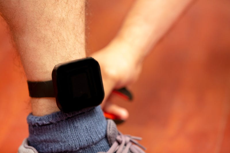 Person wearing electronic monitoring bracelet