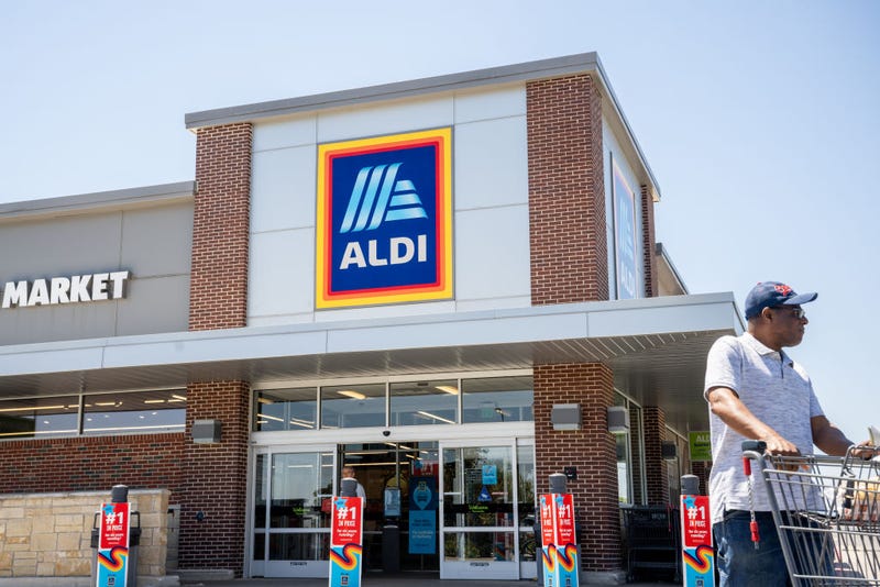 A customer walks out of an Aldi supermarket on August 17, 2023 in Pflugerville, Texas. 