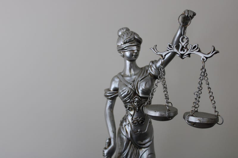 Statue of a woman symbolizing justice and law. justice and scales.