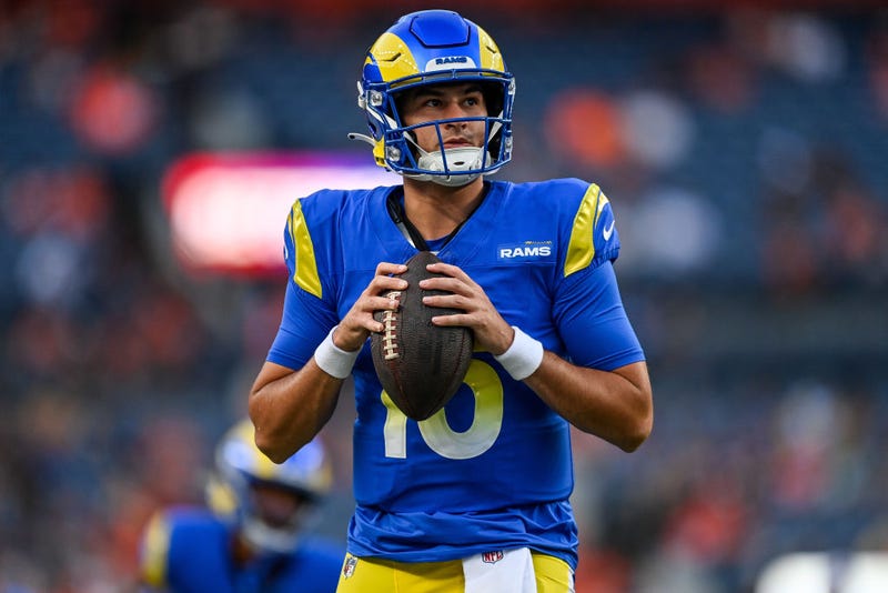 Quarterback Stetson Bennett #13 of the Los Angeles Rams warms up before a preseason game against the Denver Broncos at Empower Field at Mile High on August 26, 2023 in Denver, Colorado.