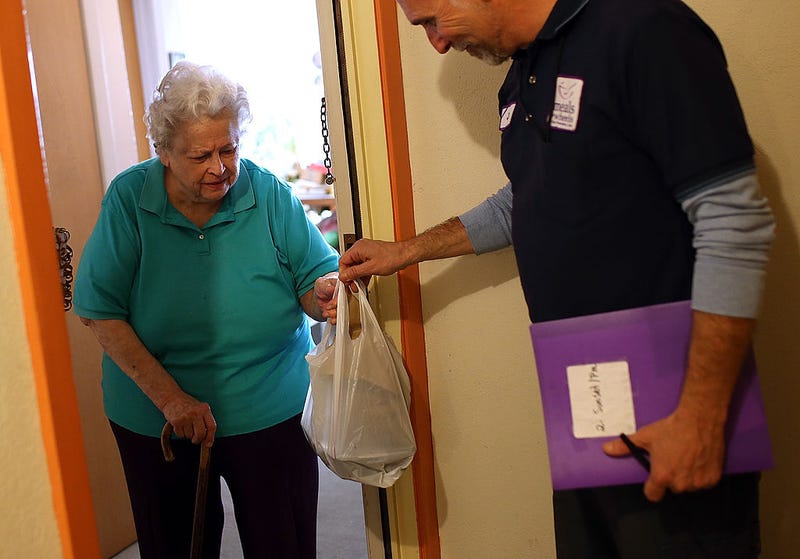 Meals on Wheels delivers to a senior citizen