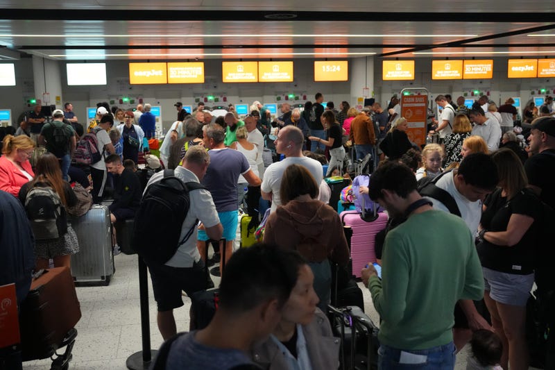 Airline passengers waiting in line at the terminal