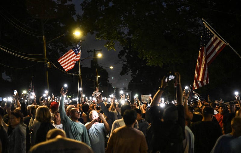 People attend a protest over a migrant shelter on Staten Island on Aug. 28, 2023
