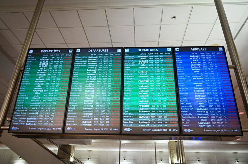 A sign shows all flights canceled at the closed Tampa International Airport in Tampa, Florida, on Aug. 29, 2023, as the city prepares for Hurricane Idalia. 
