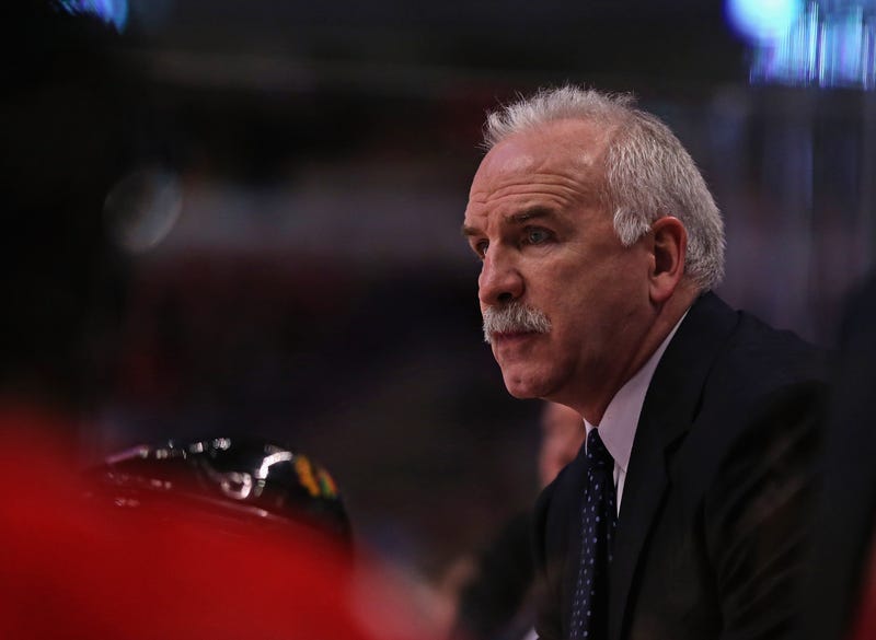 Former Head Coach Joel Quenneville of the Chicago Blackhawks gives instructions to his team against the Colorado Avalanche at the United Center on Dec. 27, 2013, in Chicago.