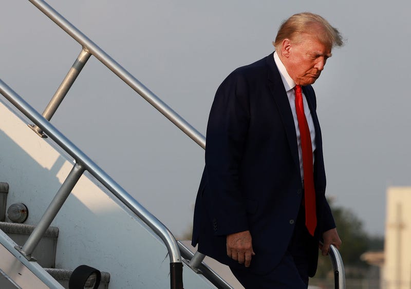 Former U.S. President Donald Trump arrives at Atlanta Hartsfield-Jackson International Airport on August 24, 2023 in Atlanta, Georgia. 