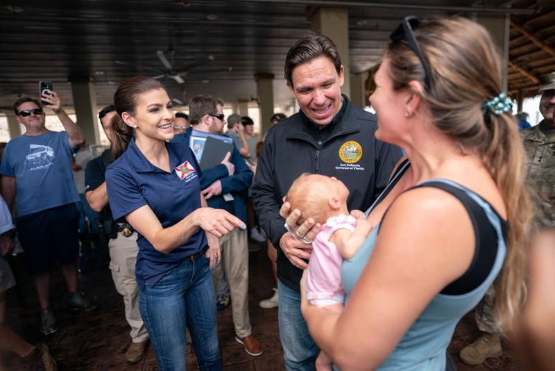 Florida Gov. Ron DeSantis, center, and his wife, Casey DeSantis, talk with Courtney Baumgartner and her daughter, Nova Baumgartner, following a press conference in the aftermath of Hurricane Idalia on August 31, 2023 in Steinhatchee, Florida. Yesterday morning, the storm made landfall at Keaton Beach, Florida as a category 3 hurricane. (Photo by Sean Rayford/Getty Images)