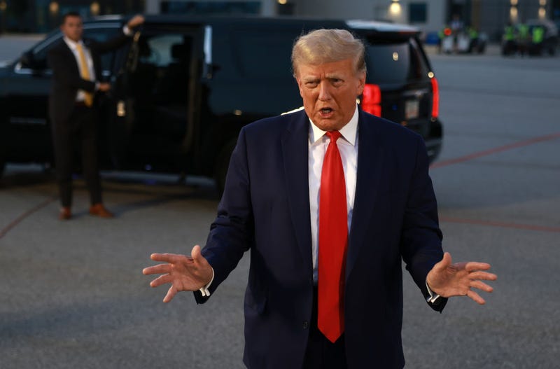Former U.S. President Donald Trump speaks to the media at Atlanta Hartsfield-Jackson International Airport after being booked at the Fulton County jail on August 24, 2023 in Atlanta, Georgia. 