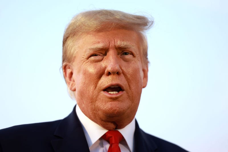 Former U.S. President Donald Trump speaks to the media at Atlanta Hartsfield-Jackson International Airport after being booked at the Fulton County jail on August 24, 2023 in Atlanta, Georgia. 