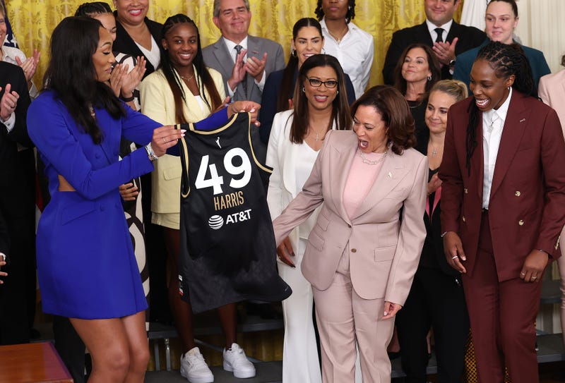 A'ja Wilson of the Las Vegas Aces presents team jersey to Vice President Kamala Harris.