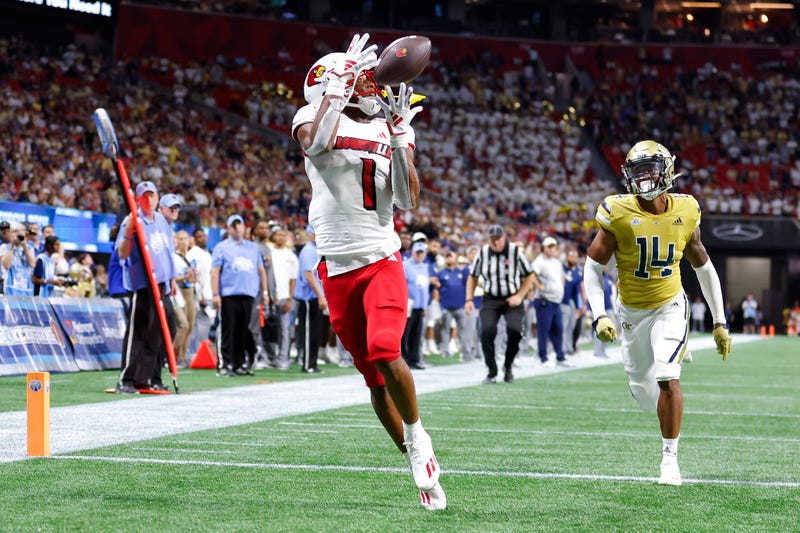 Jamari Thrash #1 of the Louisville Cardinals pulls in a touchdown reception during the second half against the Georgia Tech Yellow Jackets at Mercedes-Benz Stadium on September 1, 2023 in Atlanta, Georgia. 