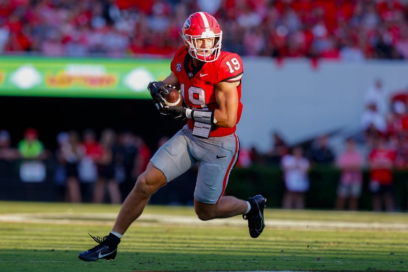 Brock Bowers #19 of the Georgia Bulldogs looks for extra yardage after the reception during the second quarter against the Tennessee Martin Skyhawks at Sanford Stadium on September 2, 2023 in Athens, Georgia.
