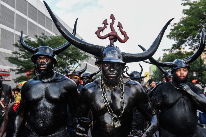 People wear horns to embody a character called "Jab Jab" (from the french for Devil) in a Caribbean street carnival starting at dawn called J'Ouvert on September 4, 2023 in the Brooklyn borough in New York City. J'Ouvert originates from the French words "jour ouvert," meaning daybreak and signals the start of Carnival. Carnival is the traditional street festival honoring the vast heritage and culture of the Caribbean diaspora. 
