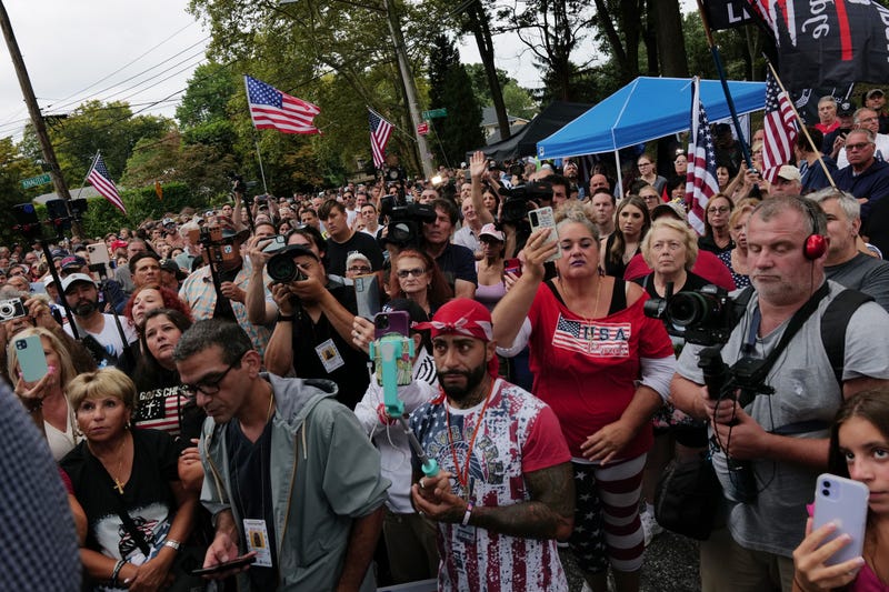 Staten Island residents gather to protest outside of a closed Catholic school-turned-migrant shelter on Staten Island on Aug. 28, 2023
