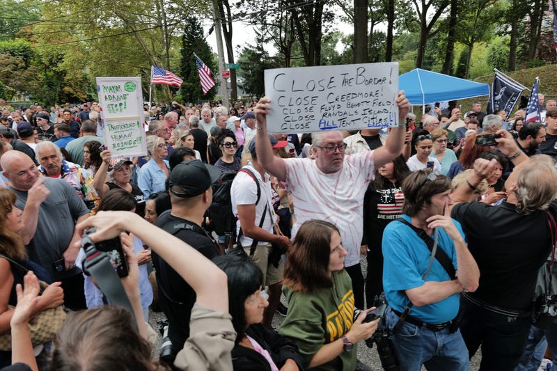 Staten Island residents gather to protest outside of a closed Catholic school-turned-migrant shelter on Staten Island on August 28, 2023 in New York City.