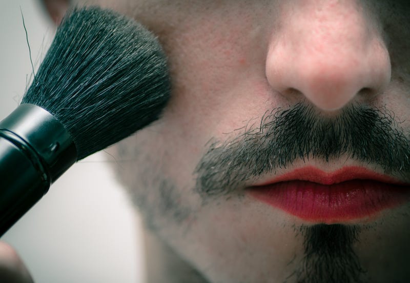 Man putting on makeup