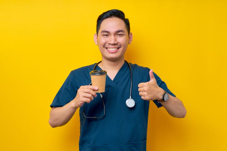 Surgeon drinking tea