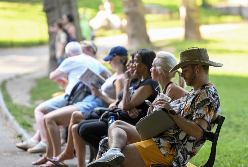 People cool off at a park in New York City on Sept. 6, 2023