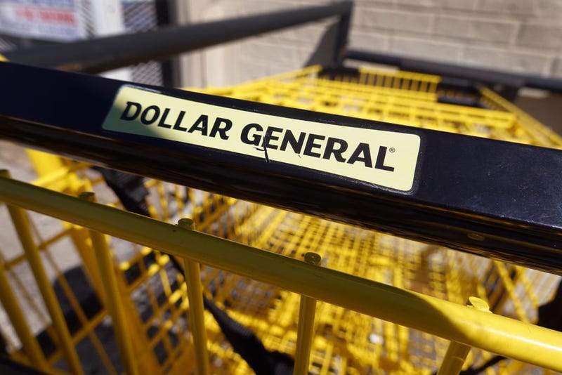 Shopping carts sit outside of a Dollar General store 