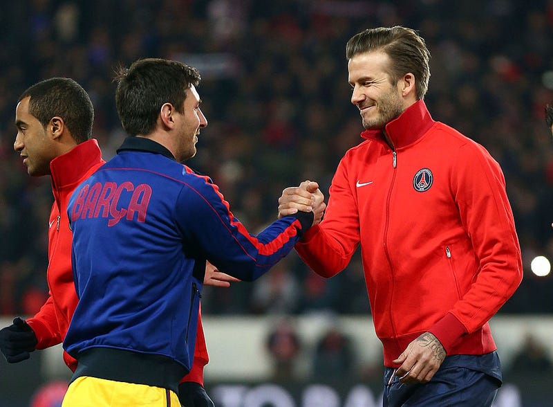 David Beckham (R) of PSG shakes hands with Lionel Messi of Barcelona ahead of the UEFA Champions League Quarter Final match between Paris Saint-Germain and Barcelona FCB at Parc des Princes on April 2, 2013 in Paris, France.