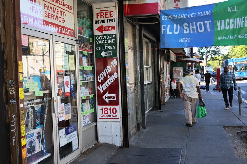 A sign for coronavirus (COVID-19) vaccination is seen on a door of a pharmacy on September 01, 2023 in the Flatbush neighborhood of Brooklyn borough in New York City. 