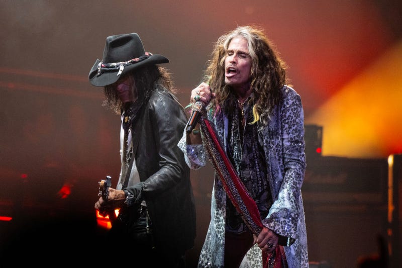 Joe Perry and Steven Tyler of Aerosmith perform live on stage