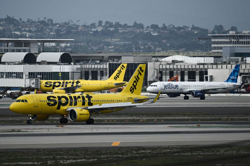 Spirit Airlines JetBlue Airlines planes taxi at Los Angeles International Airport on Sept. 11, 2023