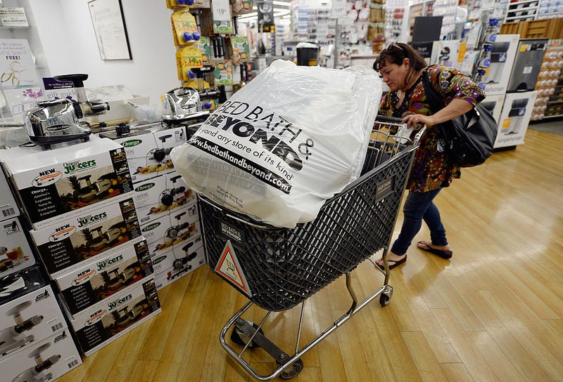 Customers carry bags from Bed Bath & Beyond store on April 10, 2013 in Los Angeles, California. The home goods retailer is expected to release fourth-quarter earnings figures after the closing bell.  