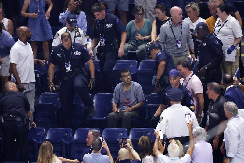 A protester disrupts the Women's Singles Semifinal match between Coco Gauff of the United States and Karolina Muchova of the Czech Republic on Day Eleven of the 2023 US Open at the USTA Billie Jean King National Tennis Center on September 7, 2023 in Queens