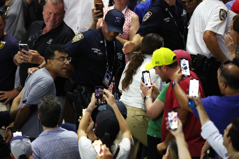 A protester disrupts the Women's Singles Semifinal match between Coco Gauff of the United States and Karolina Muchova of the Czech Republic on Day Eleven of the 2023 US Open at the USTA Billie Jean King National Tennis Center on September 7, 2023