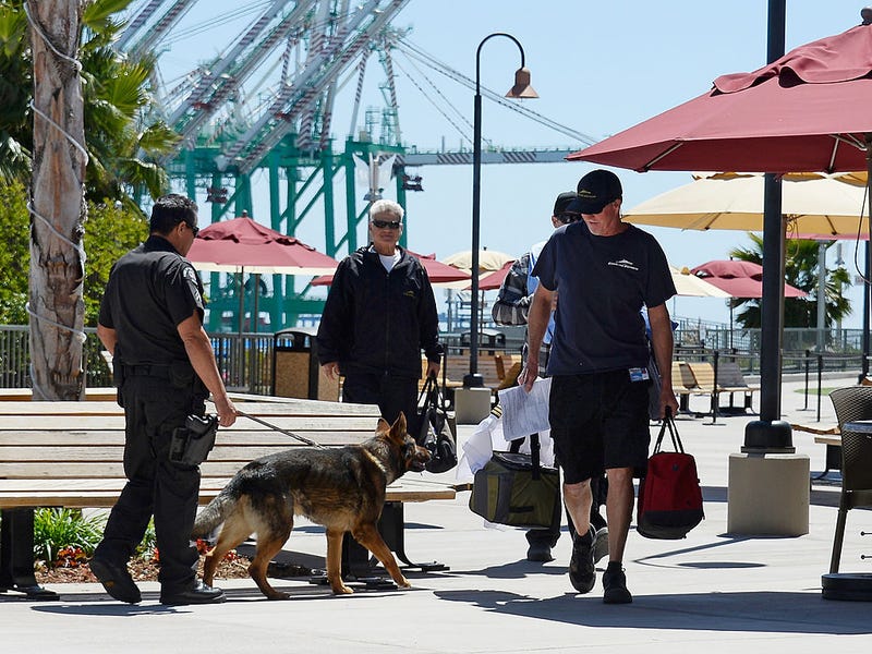 FILE - Crew members of Catalina Express arrive at the World Cruise Center of Port of Los Angeles on April 16, 2013 in San Pedro, Calif.