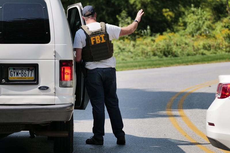 An FBI agent works with Pennsylvania and local police on the perimeter of a search zone for escaped prisoner Danilo Cavancante in September 2023.