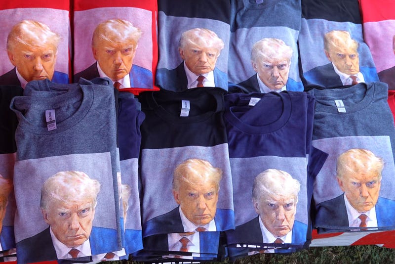 A vendor sells t-shirts featuring a mugshot of Republican presidential candidate former President Donald Trump outside of theMonument Arena on September 08, 2023 in Rapid City, South Dakota. Trump is scheduled to speak today at the arena during the Monument Leaders Rally hosted by the South Dakota Republican Party. (Photo by Scott Olson/Getty Images)