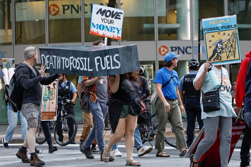 Environmental activists march during the Global Climate Strike in downtown Chicago, on Sept. 15, 2023.