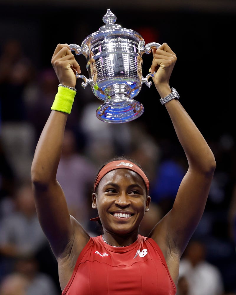 Coco Gauff celebrates with the trophy after defeating Aryna Sabalenka of Belarus in the women's championship match of the 2023 US Open, 9/9/23
