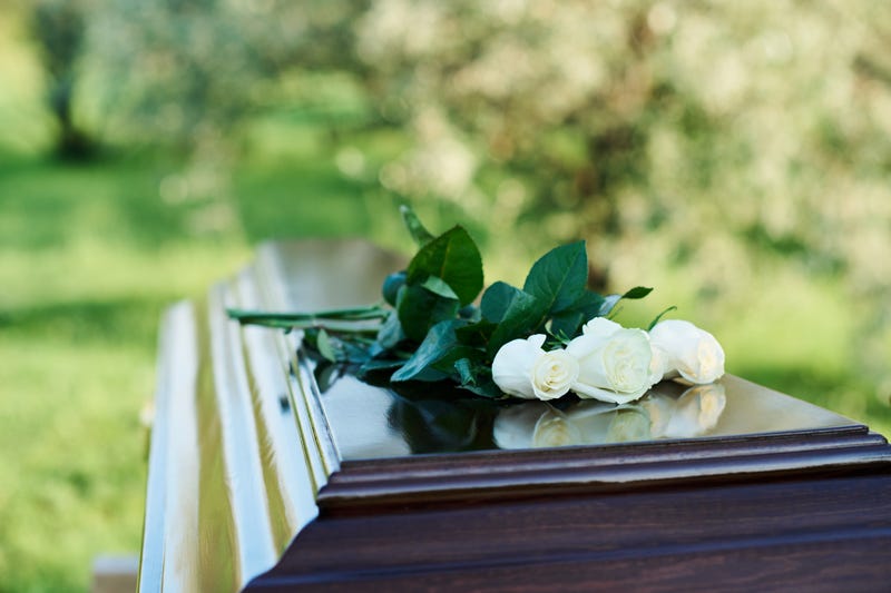 Fresh roses on a casket. 
