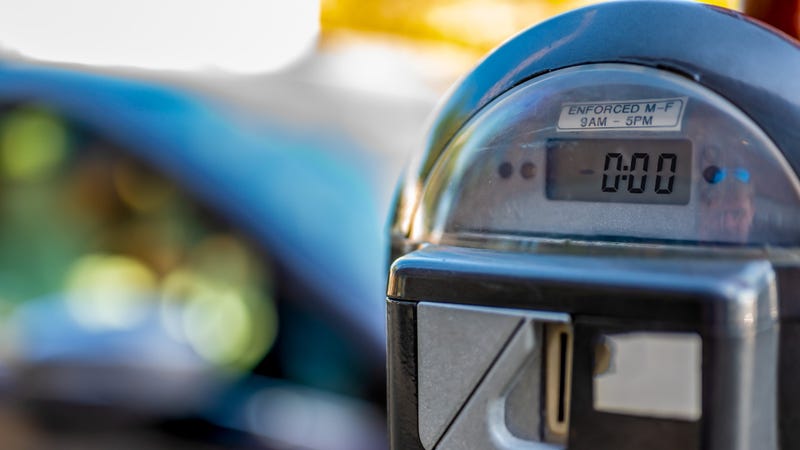 Selective focus on an expired parking meter with no time left. - stock photo
