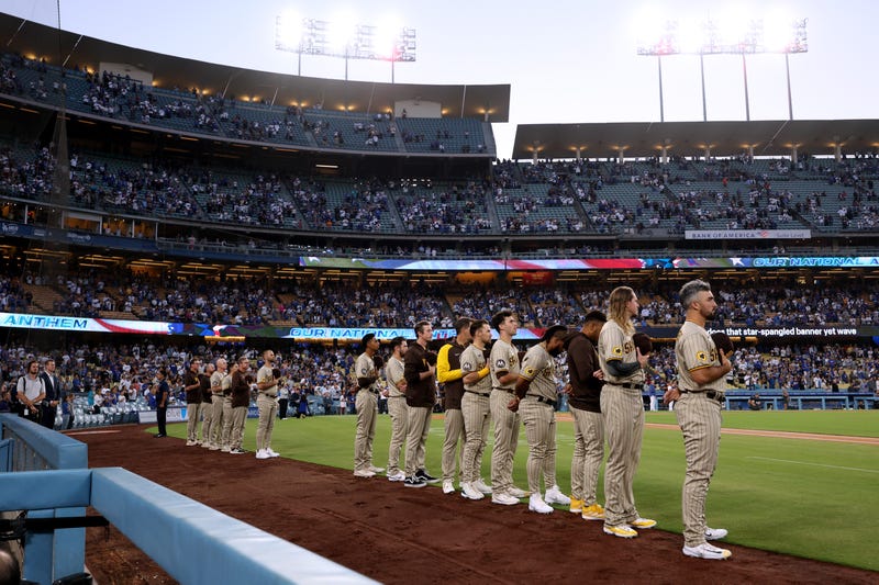 The San Diego Padres stand for the National Anthem before the game against the Los Angeles Dodgers at Dodger Stadium on September 13, 2023 in Los Angeles, California. 