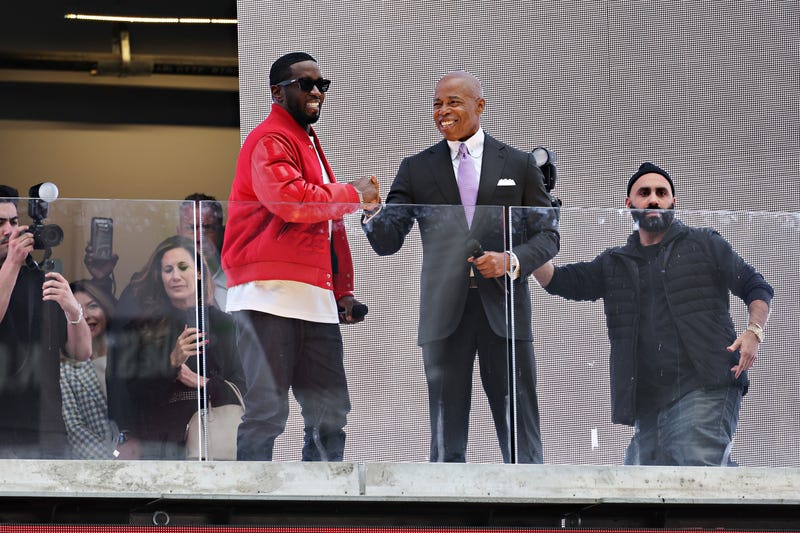 New York Mayor Eric Adams (R) presents Sean "Diddy" Combs with the keys to the city in Times Square on September 15, 2023 in New York City. (Photo by Cindy Ord/Getty Images)