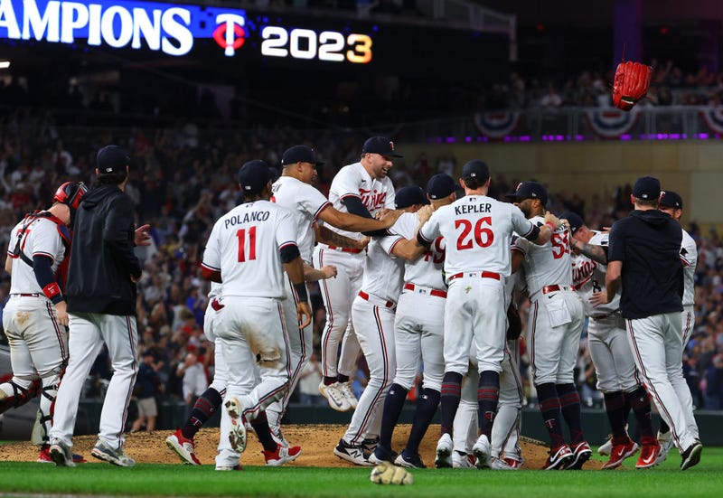 The Minnesota Twins celebrate on the field after defeating the Los Angeles Angels and clinching the AL Central Division at Target Field on September 22, 2023 in Minneapolis, Minnesota.