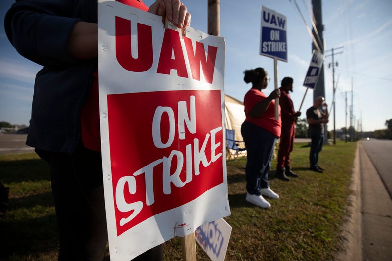 "UAW on strike" sign