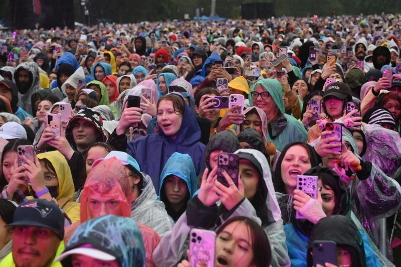 People wearing raincoats attend Global Citizen Festival at Central Park in New York City on September 23, 2023