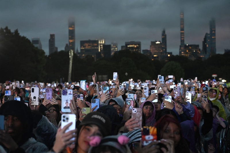People wearing raincoats attend Global Citizen Festival at Central Park in New York City on September 23, 2023