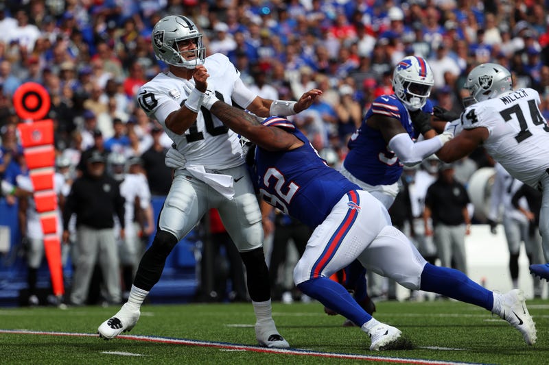 DaQuan Jones #92 of the Buffalo Bills hits Jimmy Garoppolo #10 of the Las Vegas Raiders during the first quarter at Highmark Stadium on September 17, 2023 in Orchard Park, New York. 